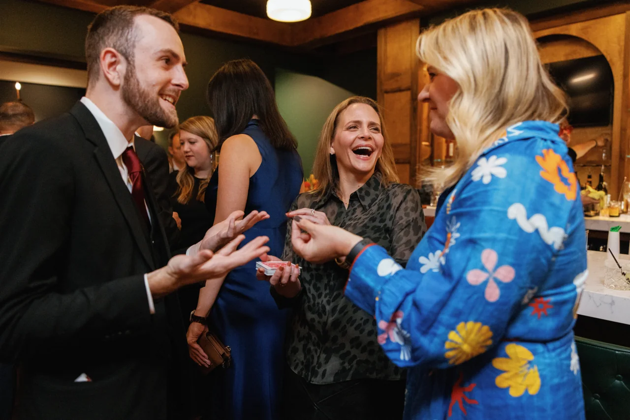 Frankie Foti performing close-up magic for guests at a corporate event in Nashville