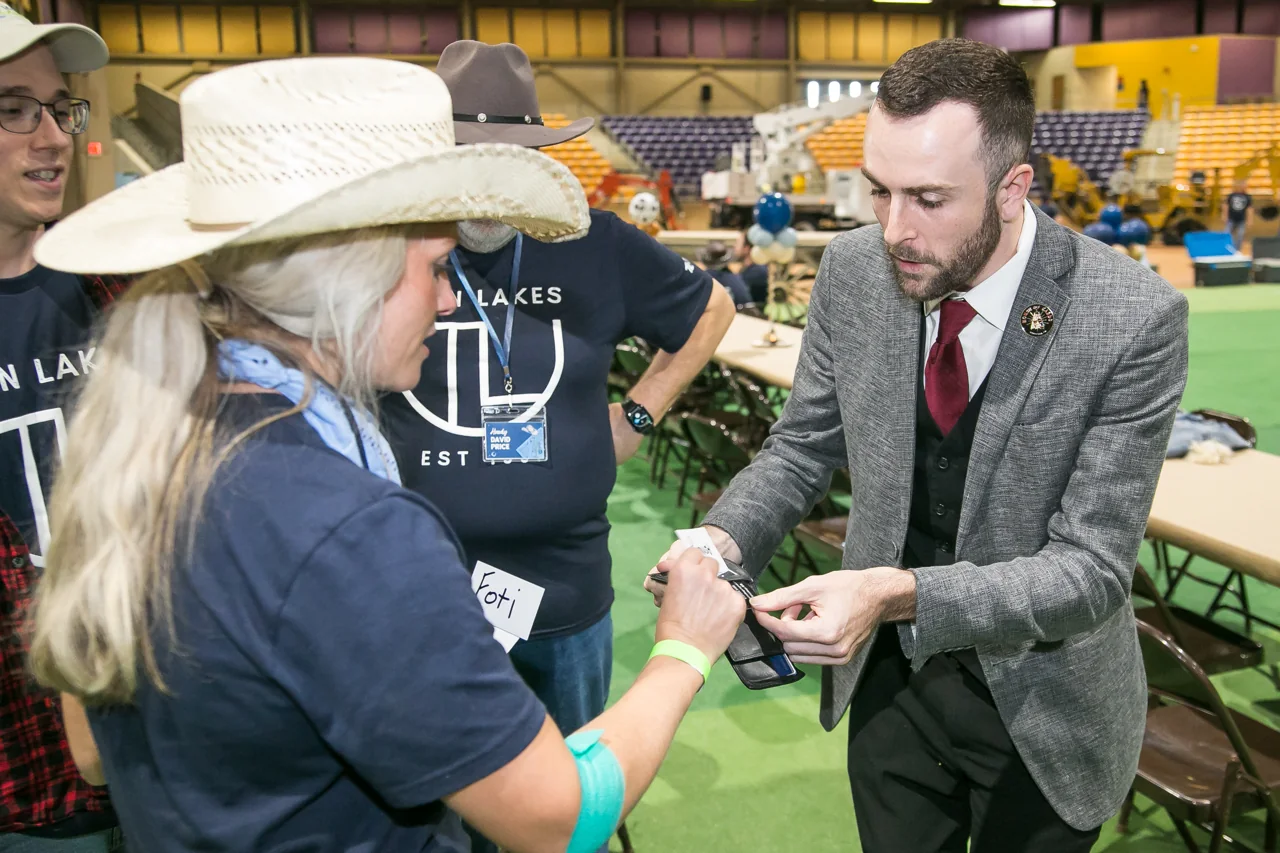 Frankie Foti performing close-up magic for guests at a Nashville corporate event